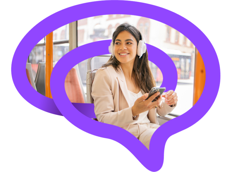 Woman on bus looking at phone wearing headphones