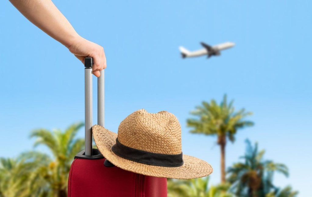 Someone getting ready to catch a flight from a tropical vacation
