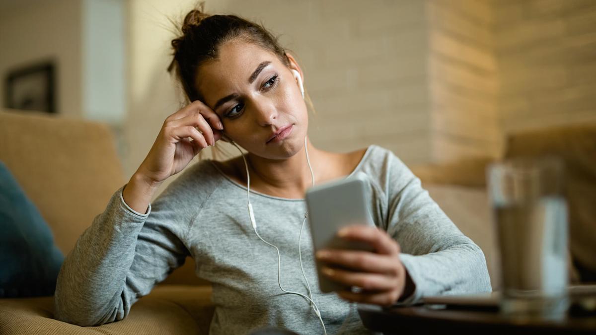 Young woman scrolling on her phone