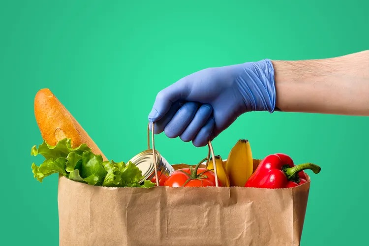 Picking up a bag of groceries